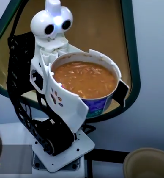 Wet can Feeder Robot Encompassing Gripper